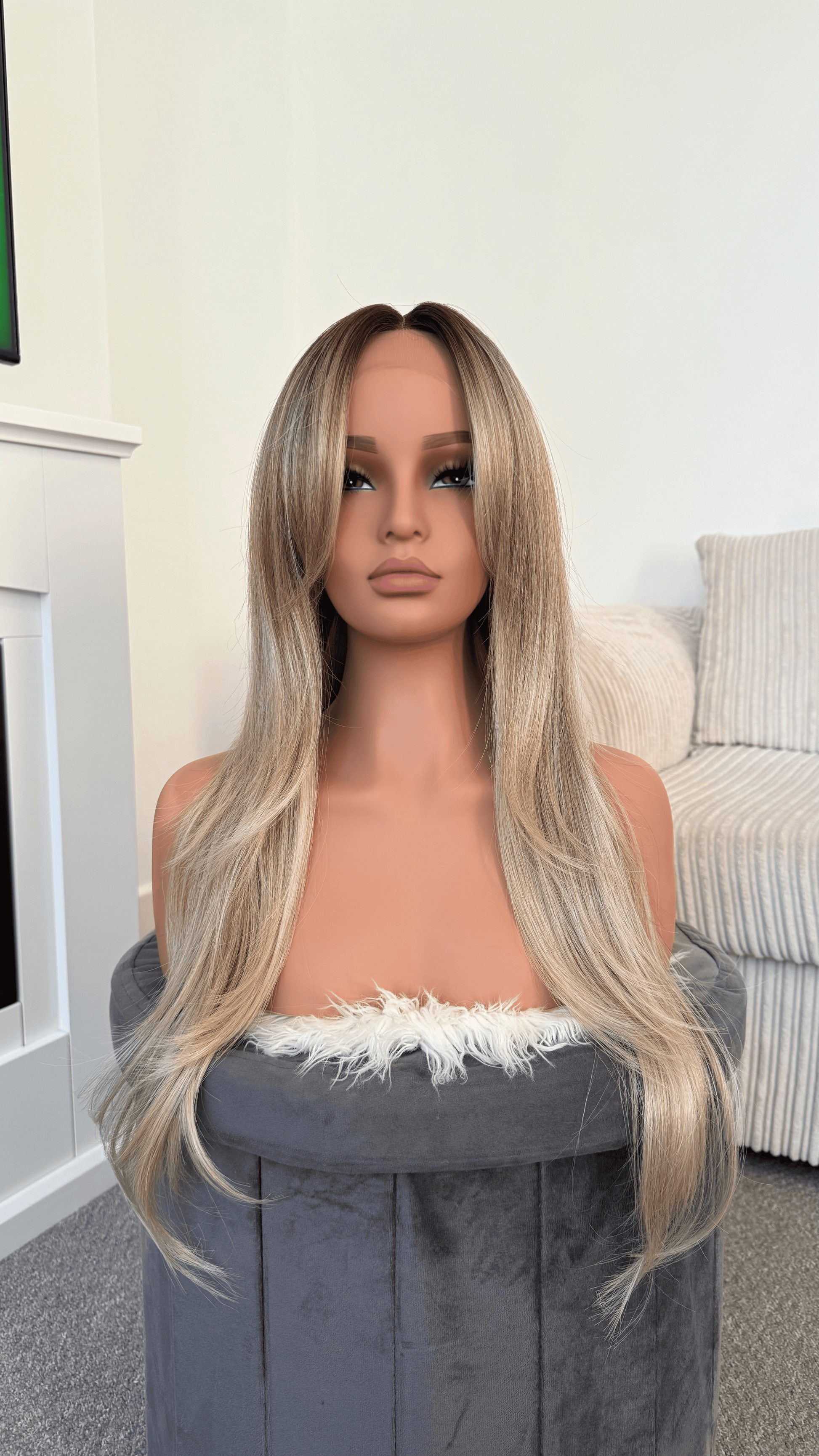 model 26-inch ombre ash blonde lace wig with layered volume and natural gradient.