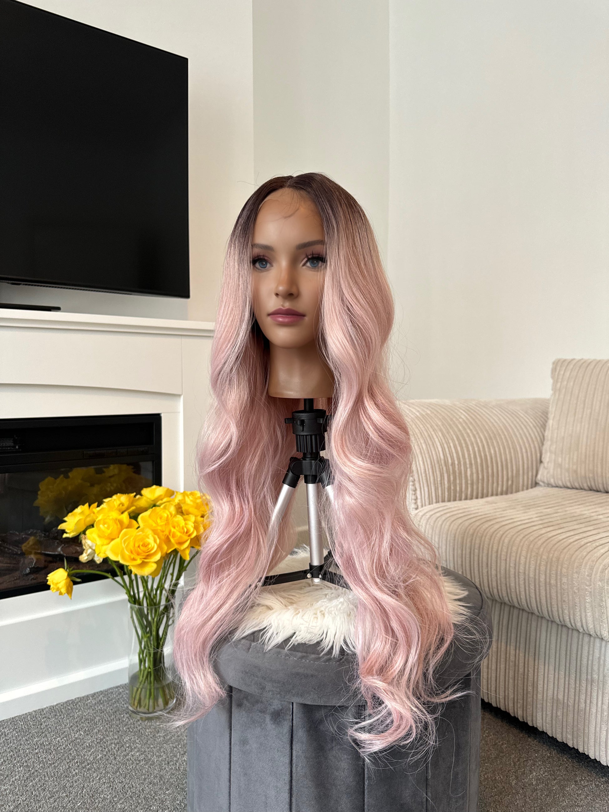 model 24-inch pink wavy lace front wig with a natural-looking hairline and flowing waves