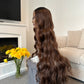 product Back view of a 36-inch long wavy brown wig, emphasising the flowing waves and rich brown shade