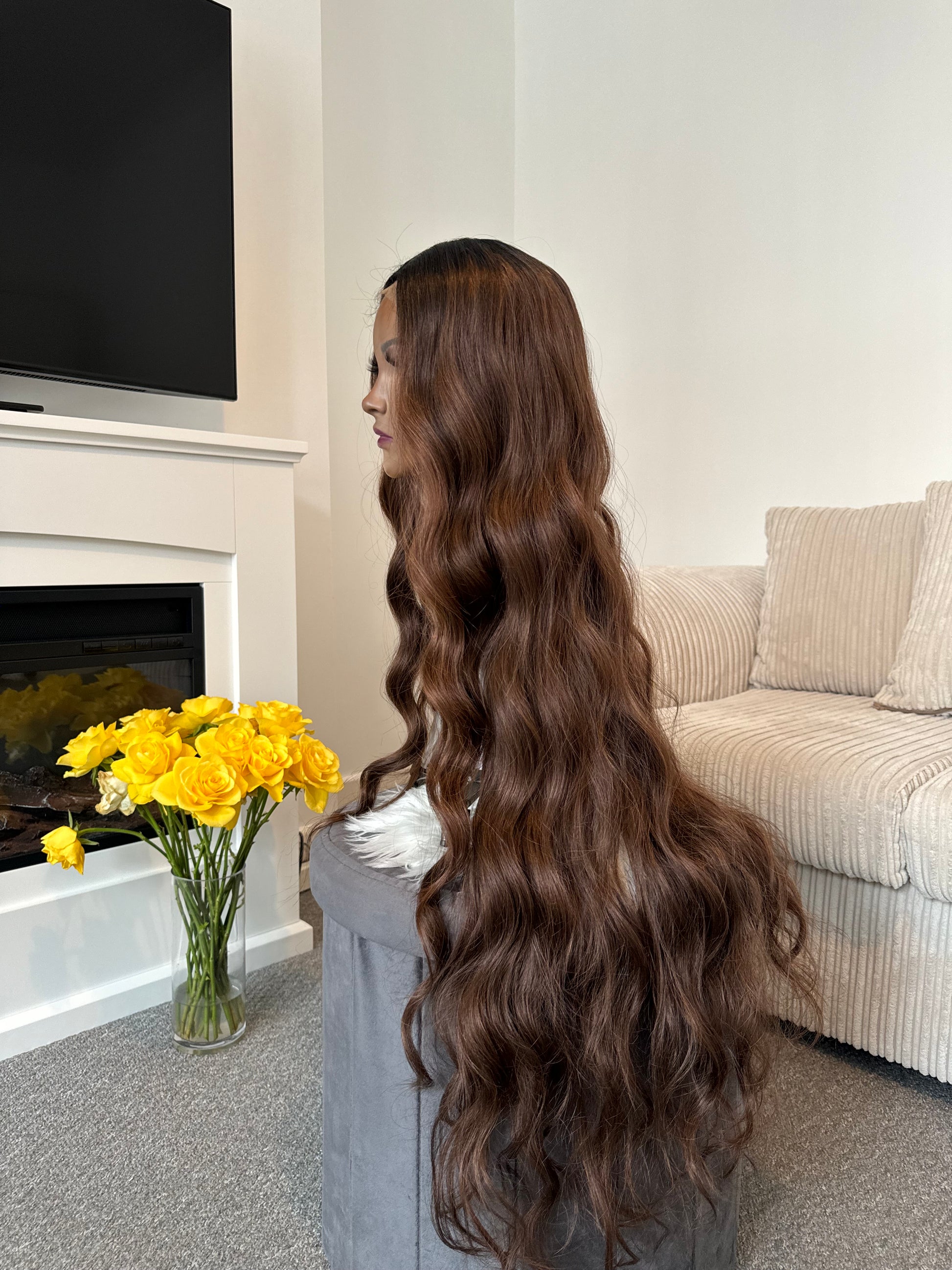 product Back view of a 36-inch long wavy brown wig, emphasising the flowing waves and rich brown shade