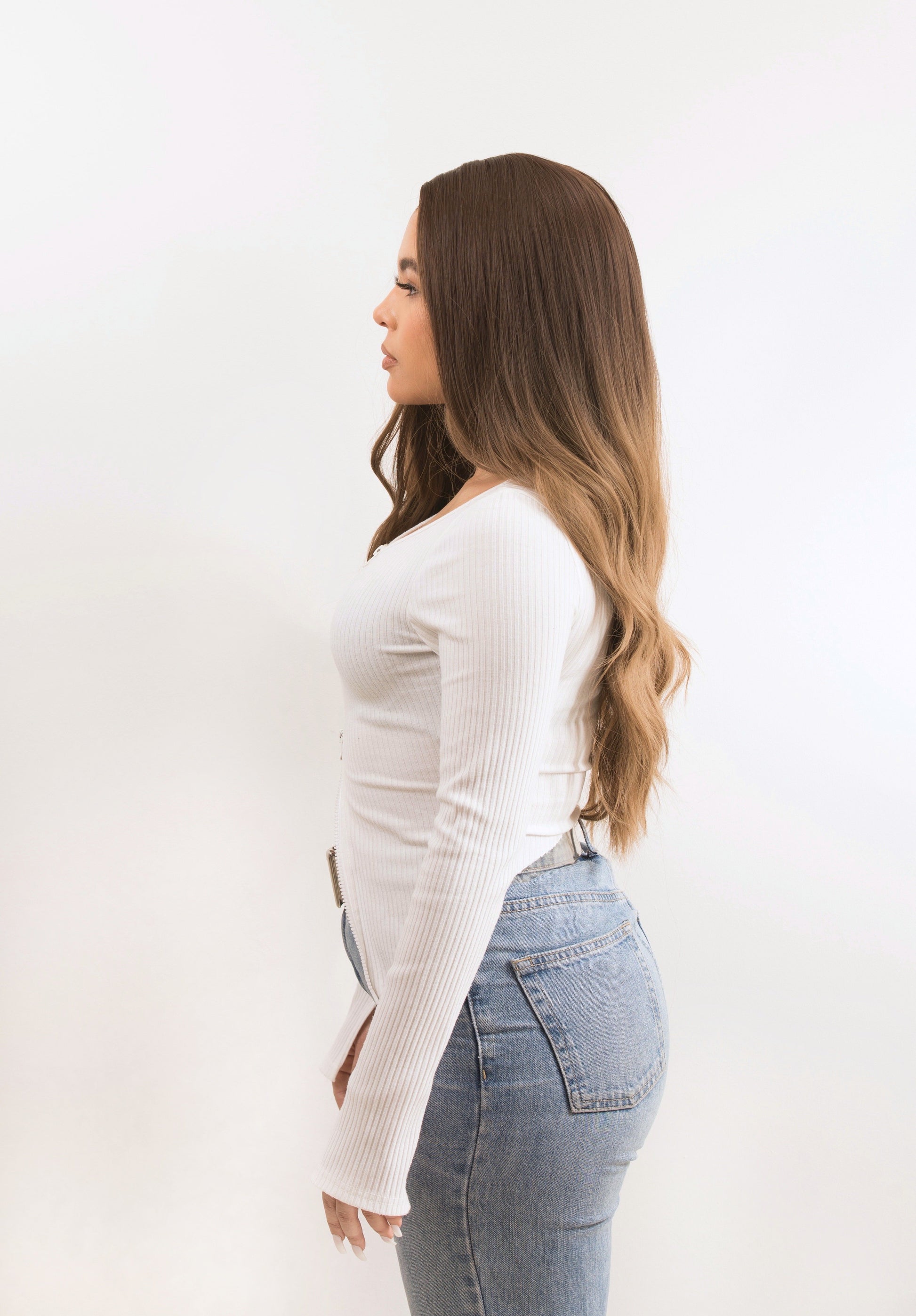 Side view of a balayage wig with highlights, highlighting the seamless blend of brown and blonde tones