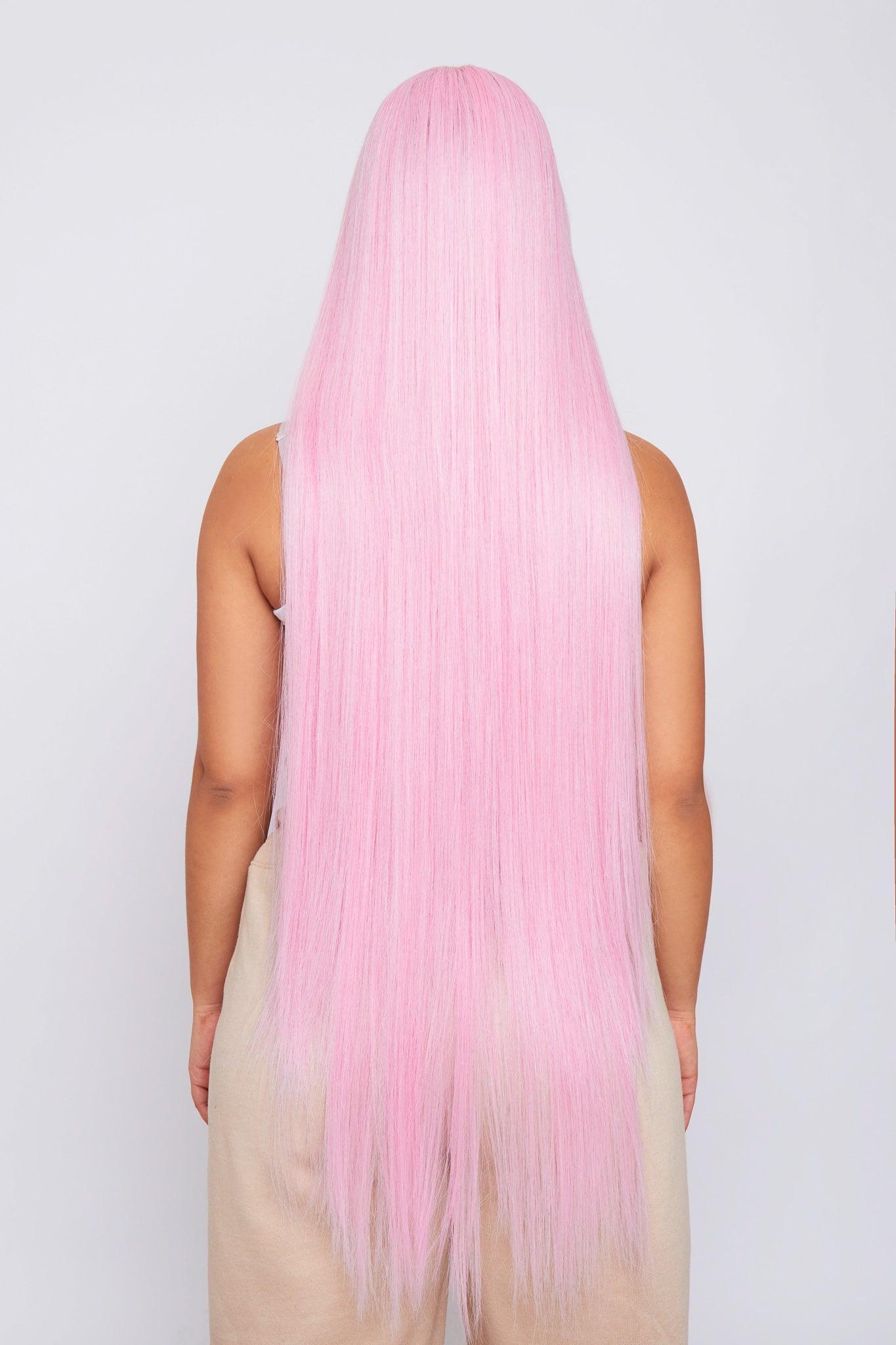 Full view of a long synthetic pink wig, emphasizing its striking color and versatile styling options