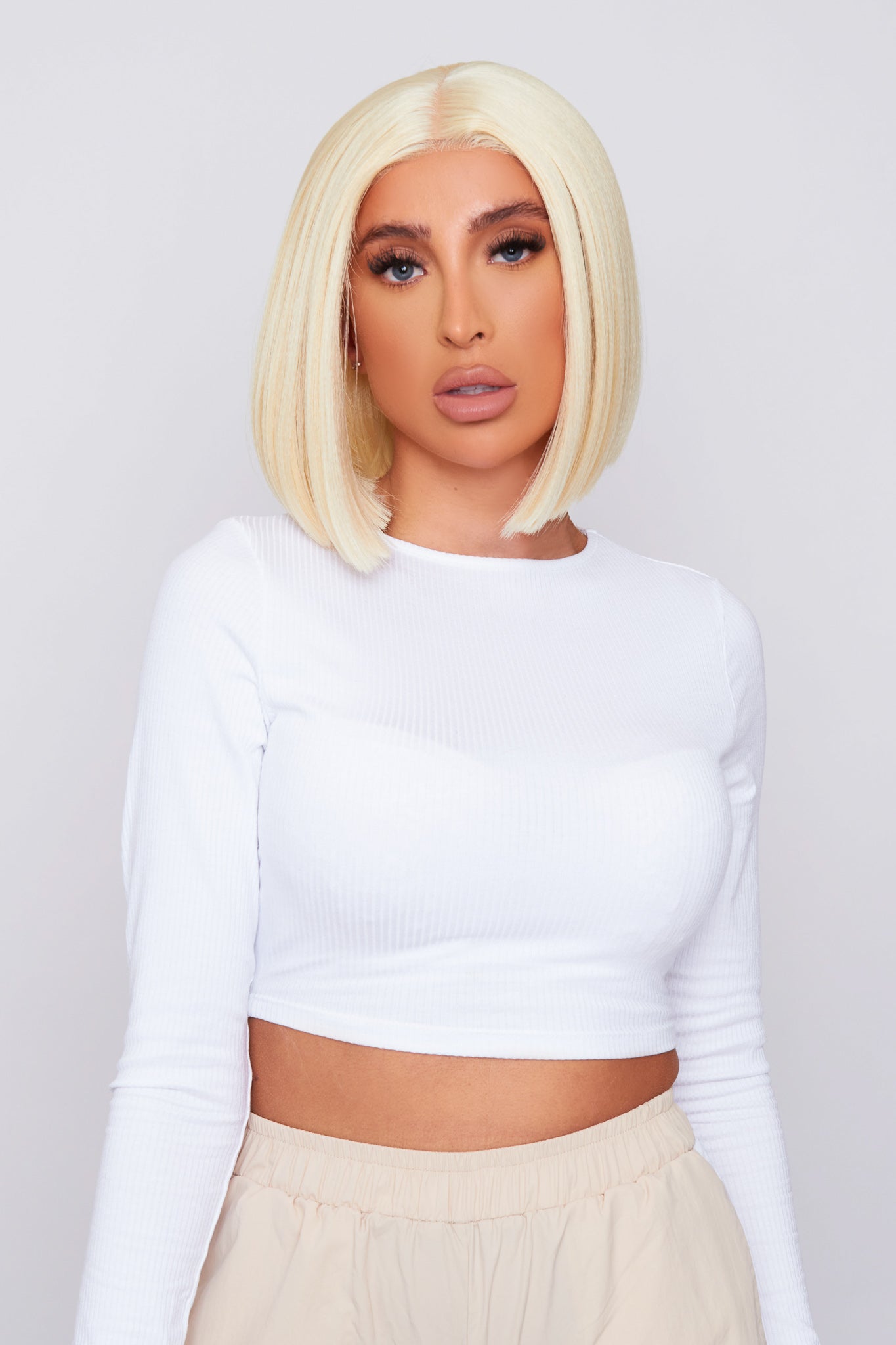 10-inch blonde lace front bob wig with a sleek cut and natural hairline, made from high-quality synthetic hair