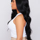 Close-up of a synthetic black wig featuring elegant waves and a seamless lace front for a realistic look