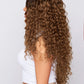 Curly brown lace front wig with voluminous curls and a natural-looking lace base, showcasing rich brown color product
