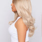  Blonde synthetic wig with natural-looking blonde hair, showcasing realistic texture and elegant style