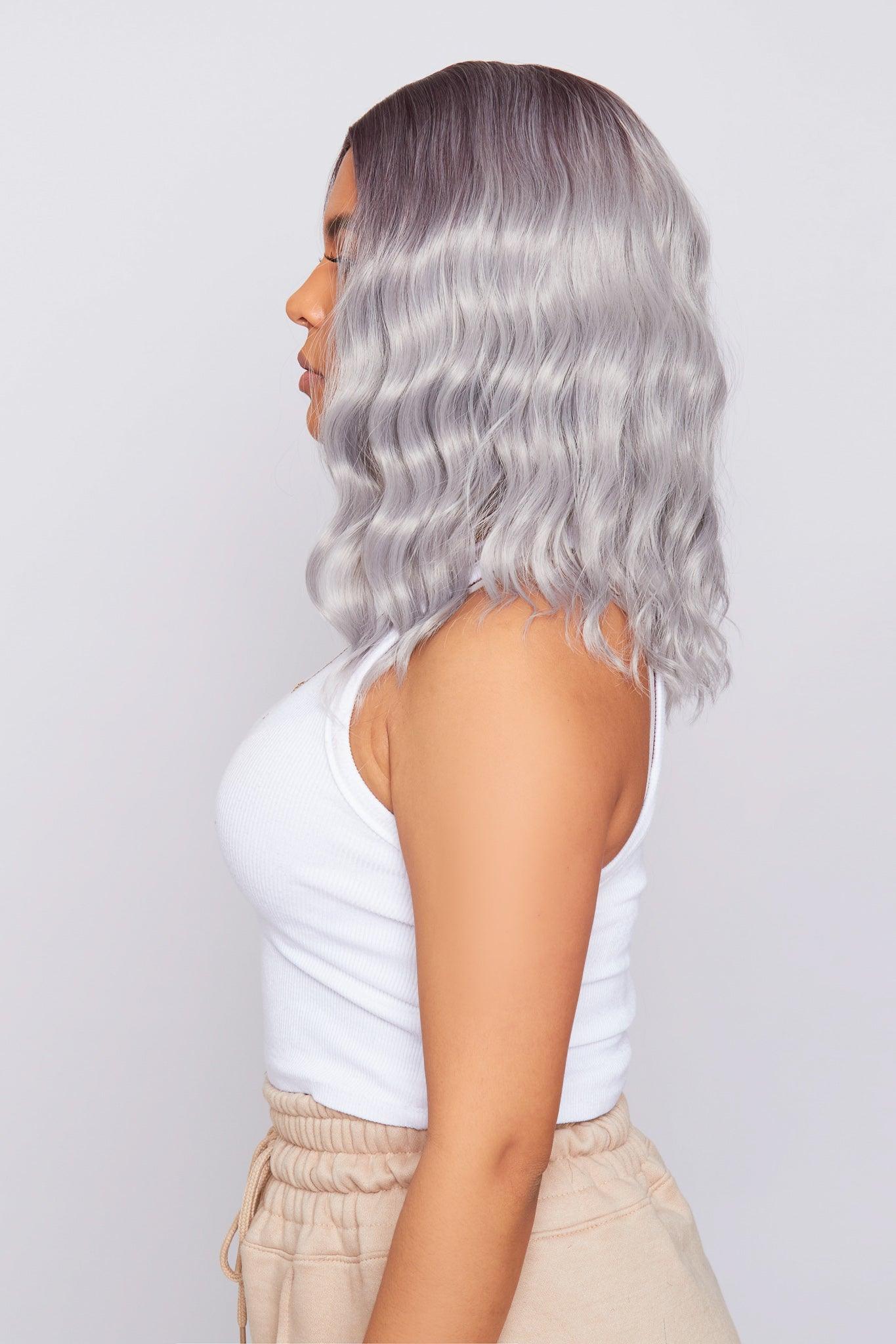 model Side view of a grey bob wig with a short length and no lace, emphasizing the sleek design and color