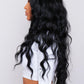 product 28-Inch wavy black synthetic hair wig with long, flowing waves