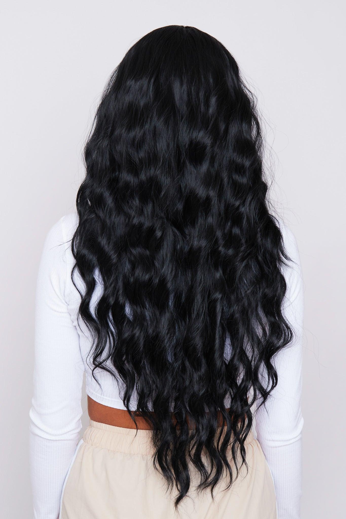 Back view of the 28-inch wavy black wig, showing the voluminous and smooth synthetic hair