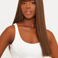Close-up of a synthetic brown wig featuring chic bangs and a realistic texture