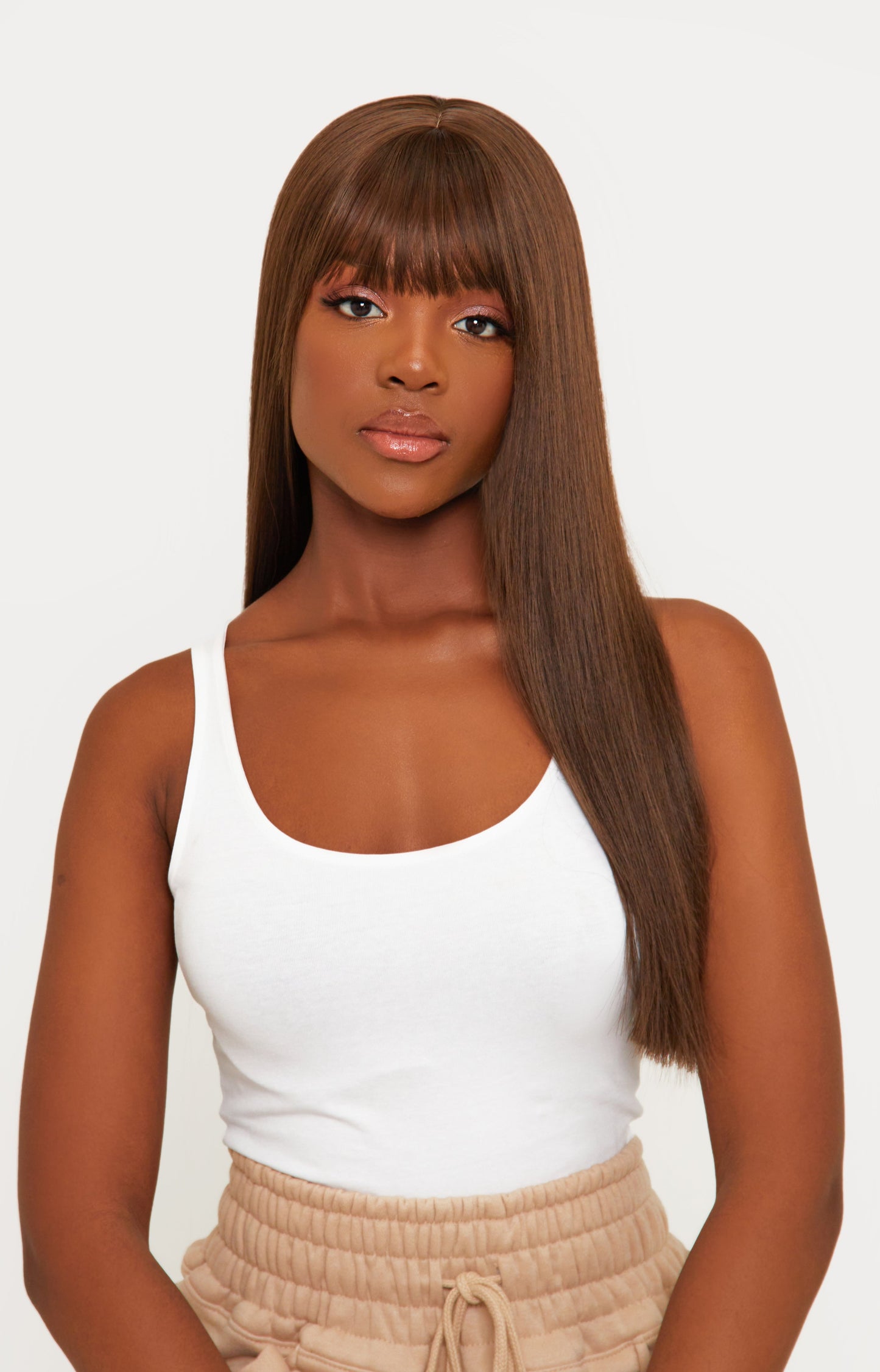 model Brown bangs synthetic wig with a rich brown color and stylish bangs, crafted from high-quality synthetic fibers