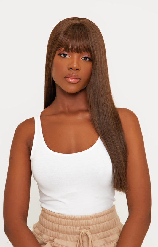 model Brown bangs synthetic wig with a rich brown color and stylish bangs, crafted from high-quality synthetic fibers