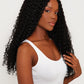 model Full view of a kinky curly black wig, showcasing its bold curl pattern and natural appearance